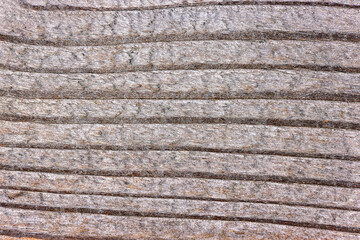 Striated weathered wood grain texture background in light gray tone