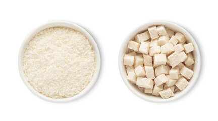 Bowls with sweet dried organic coconut flakes and bites isolated on white background.Top view.