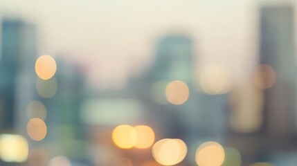 A blurry cityscape with soft lights and muted colors, creating a dreamy and abstract feel.