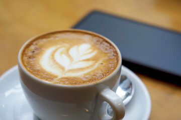Close-up of a cappuccino coffee on a table in a cafe