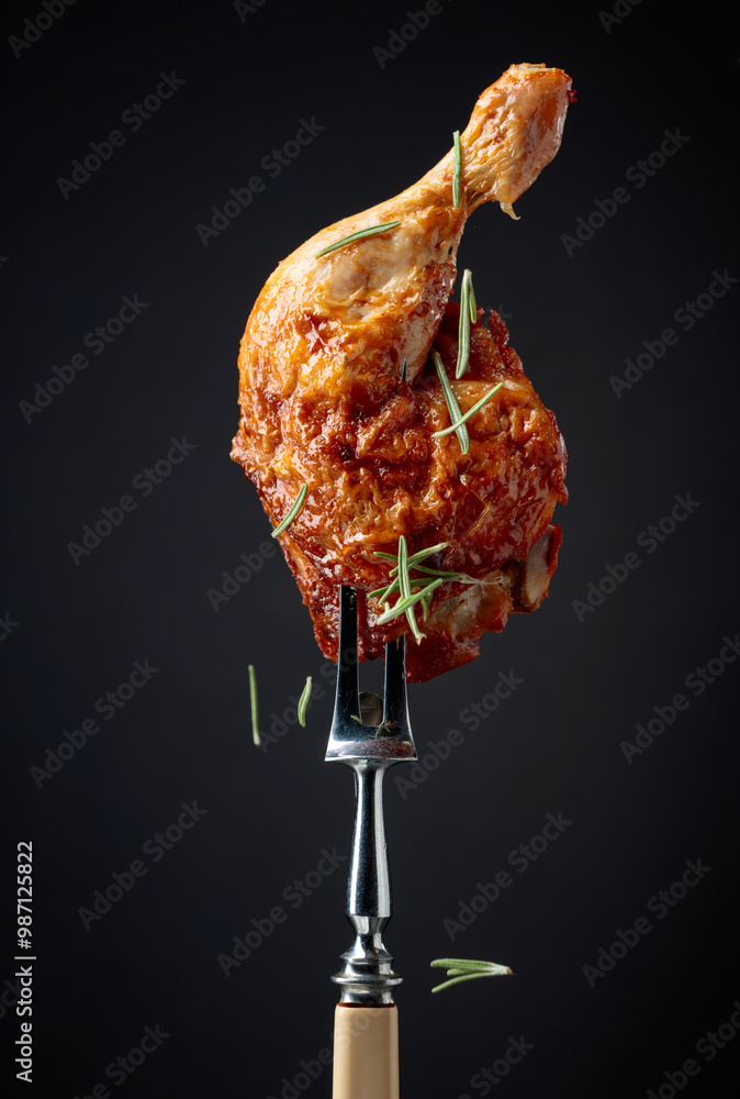 Poster Hot chicken drumstick on a fork.