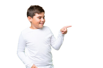 Little caucasian kid over isolated chroma key background pointing finger to the side and presenting a product