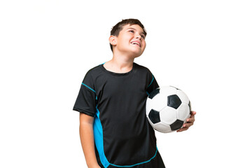 Little caucasian football player kid over isolated chroma key background laughing