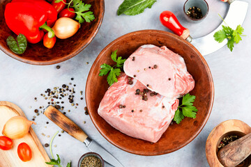 Raw cuts of pork meat.