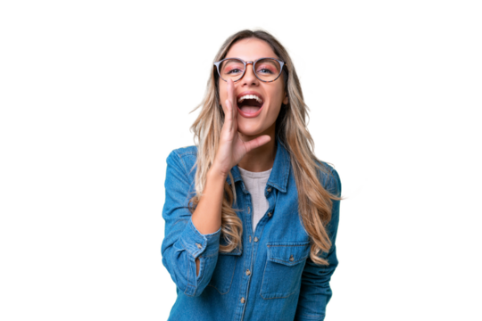 Young Uruguayan woman over isolated background shouting with mouth wide open