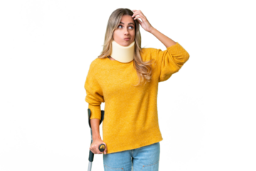 Young Uruguayan woman wearing neck brace and crutches over isolated background having doubts and with confuse face expression