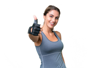 pretty Sport Uruguayan woman over isolated background with thumbs up because something good has happened
