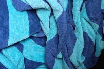Towel texture close up. Terry cloth bath or beach towel. Soft fluffy textile. Top view. towel macro material.