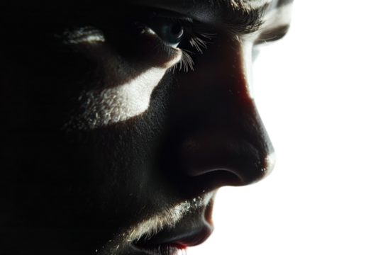 A man with a dark face and a shadow on his face