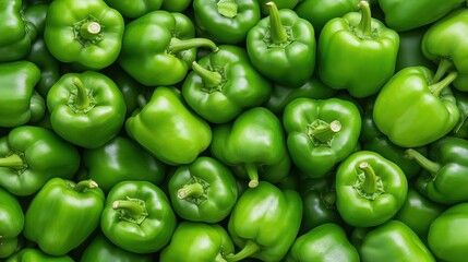 Fresh green bell peppers background.