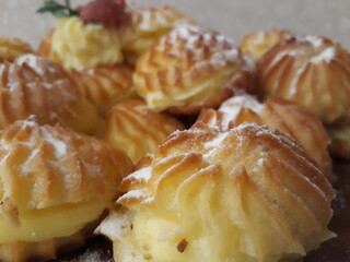 Delicious cakes served on a wooden board