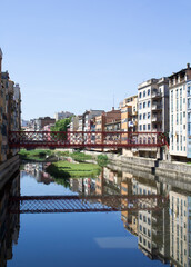 Obraz premium View of the old town and eiffel bridge on a summer day. Gerona. Spain.