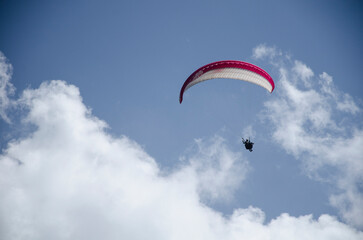 Paragliding in the sky. Flying over mountains, Extreme sport in mountain with nature, High-Flying Adventure, Uttarakhand, India.
