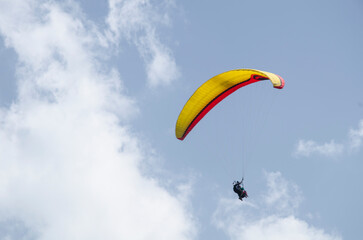 Paragliding in the sky. Flying over mountains, Extreme sport in mountain with nature, High-Flying Adventure, Uttarakhand, India.