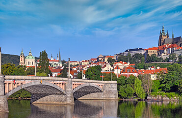 View from the bank of the Vltava river to Manes bridge and the Prague castle, Czech republic