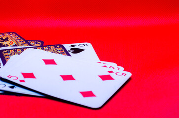 playing cards on a red background.