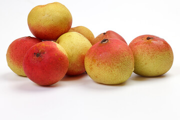 Green yellow red ripe mini pear sweet juicy on white background basket fork