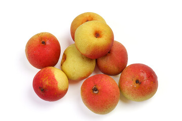 Green yellow red ripe mini pear sweet juicy on white background basket fork