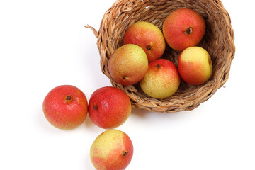 Green yellow red ripe mini pear sweet juicy on white background basket fork