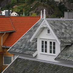 Gable of a white timber house in Egersund with beautiful ornaments, Norway.