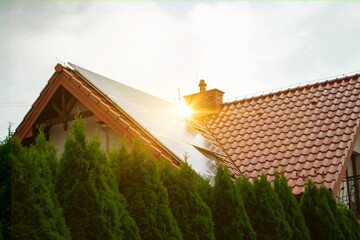 Solar power energy on the roof to a standard house. Solar power panels ,Photovoltaic modules for...