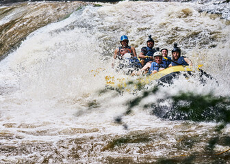 Raft, river and people in boat with speed for fun adventure, holiday and outdoor vacation with friends. Extreme sports, travel and group in water for canoeing, kayaking and rowing activity in lake