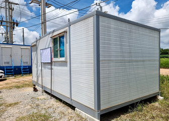 Mobile office buildings or container site office and Mobile toilets at the construction site of substation.