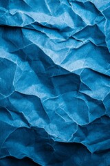 Obraz premium A tight shot of blue paper showcasing a wavy texture at its bottom edge