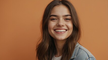 Fototapeta premium teenage american woman on pastel orange background model close-up smiling with beautiful teeth for ad concept space for text