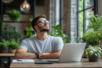 Obraz premium Calm Moment: Employee Finding Relief from Workplace Stress by Taking a Deep Breath and Gazing out the Window