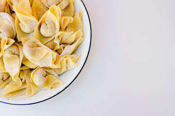 Raw wonton or dumpling dough is called pangsit in Indonesian. The term pangsit is used interchangeably with wonton or dumplings in Indonesian cuisine. 