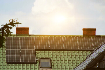 Solar power energy on the roof to a standard house. Solar power panels ,Photovoltaic modules for...