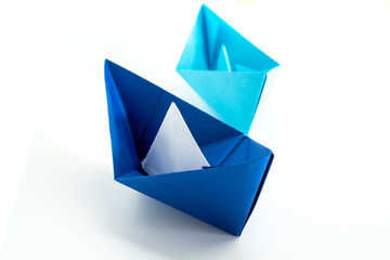 Paper colored boat isolated on white background. origami crafts. transport concept. origami.