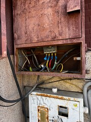 Exposed Electrical Wires on the Street. Dangerous Electricity. Hazard