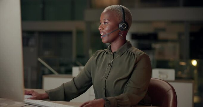 Black woman, talking and microphone with computer, office and night as multilingual support agent. Female person, tech and virtual call for international contact center, conversation and help desk