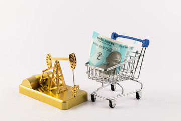 Republic of India 50 Rupee note and miniature gold oil pump