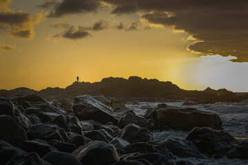 Tenerife, Benijo, June 2022: Lone photographer at sunset capturing the view