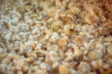 Close up oatmeal. Oats texture. Breakfast ingredient. Nutrient rich