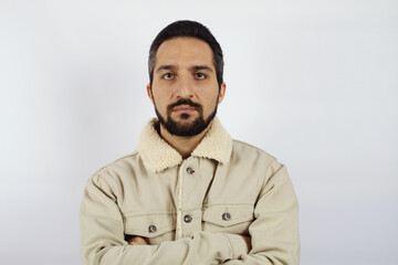 Portrait of a man in a warm white jacket on a white background