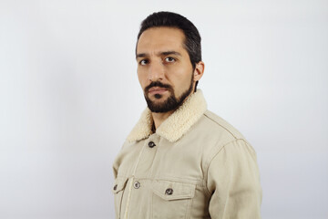 Portrait of a man in a warm white jacket on a white background