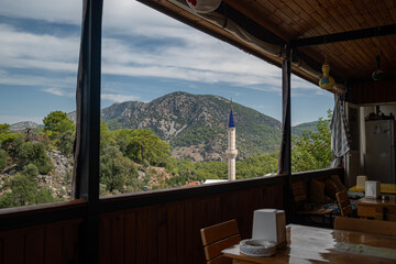 View of Gokbel Mosque from a roadside cafe. Near Dalyan in Turkiye.