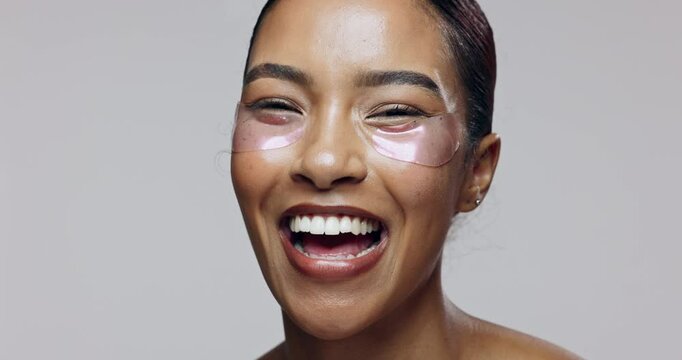 Woman, eye and gel patch for skincare, dermatology and hydration with hyaluronic acid and aloe vera. Model, happy and mask in studio for healthy skin, face and beauty on white background in Brazil