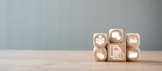 Wooden blocks with business icons symbolizing timesheet concepts, including time management,...