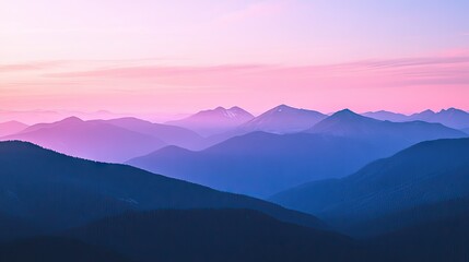 Obraz premium Flat lay of a mountain top view at dusk, with the sky turning shades of pink and purple as the last light of day fades behind the peaks.