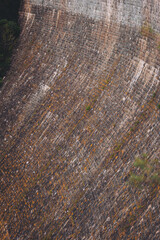 Fototapeta premium Dike at Pontechianale in Val Varaita, Italy, 2023. Wall of the dike at Pontechianale. 