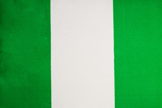 National flag of the state of Nigeria close-up. State background.