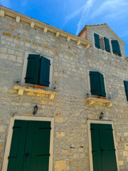 old stone house with shutters