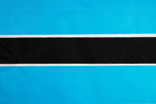 National flag of the state of Botswana close-up. State background.