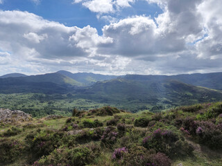 Green hills under blue summer sky landscape in Ireland