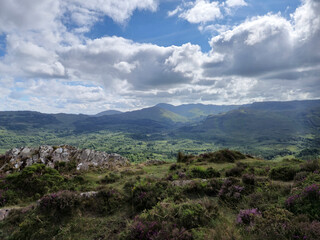 Green hills under blue summer sky landscape in Ireland